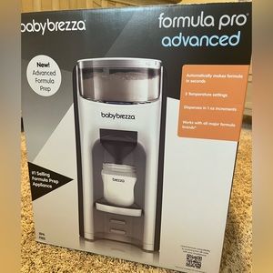 Baby Brezza advanced formula pro. Box never opened! Tape still on sides on box